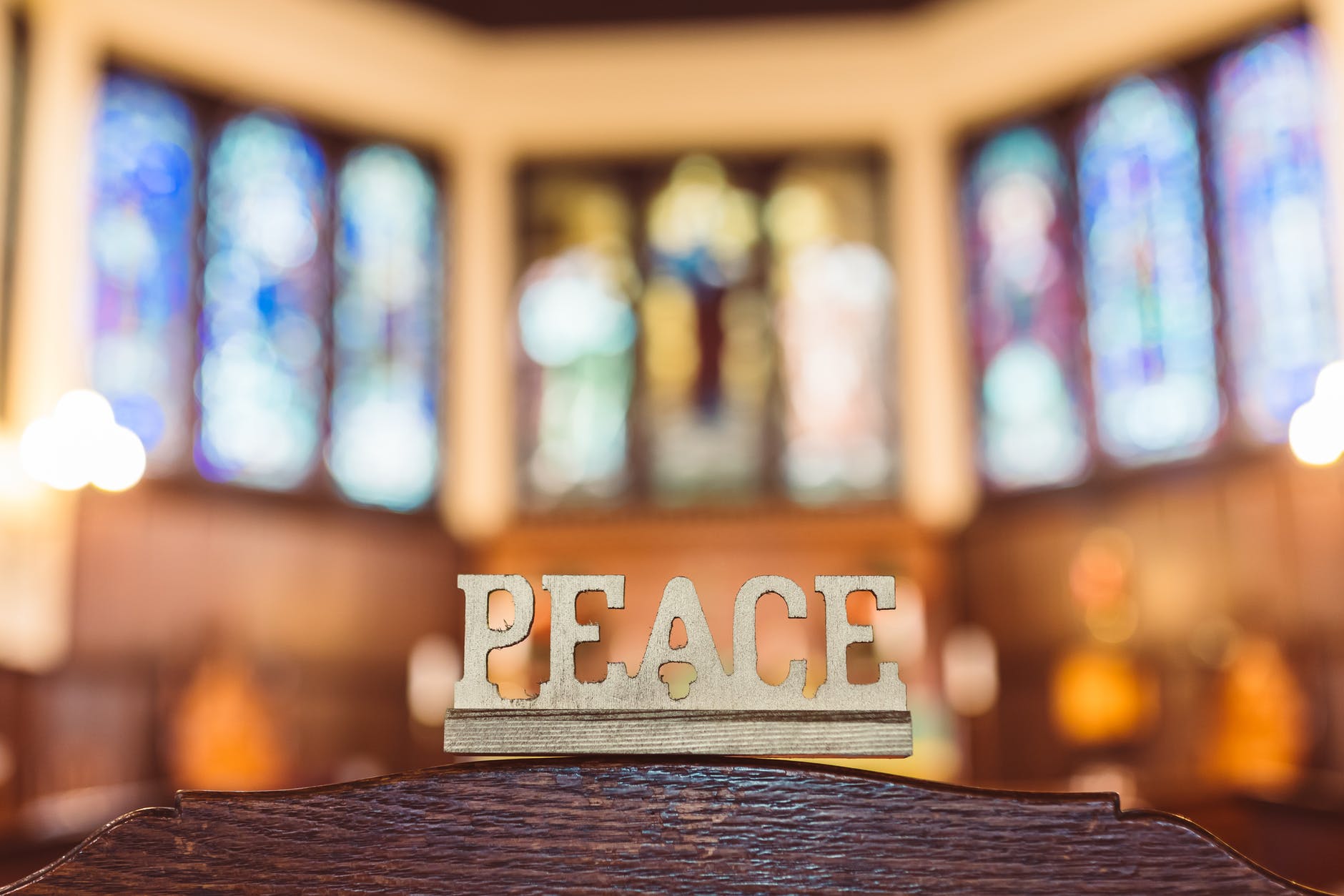 peace word carved in wood