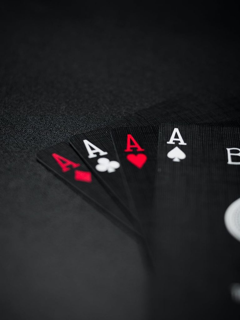 black playing cards on black background