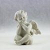 white ceramic figurine of angel illustration