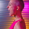 expressive bald woman shouting in studio