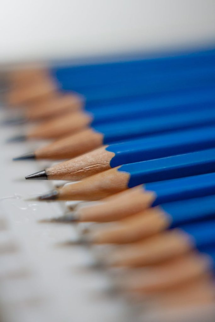tilt shift lens photography of blue pencils