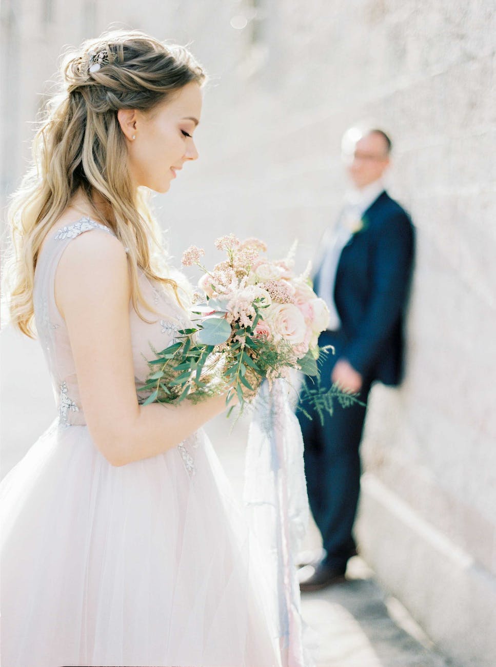photo of a bride with a bouquet of roses