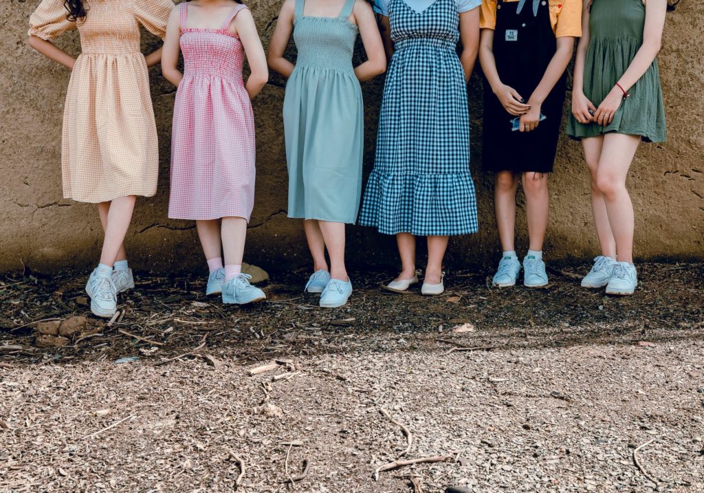 women standing wall