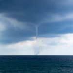 waterspout forming over the horizon