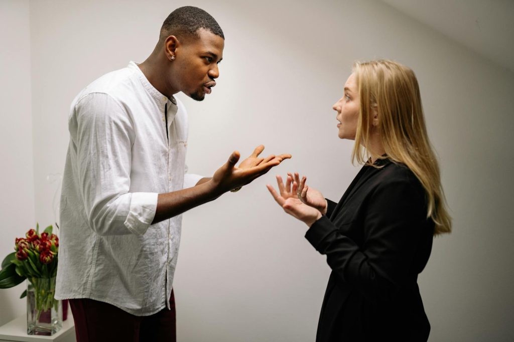 man having an argument with a woman